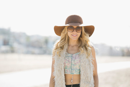 Portrait Of Woman Wearing Sunhat On Beach