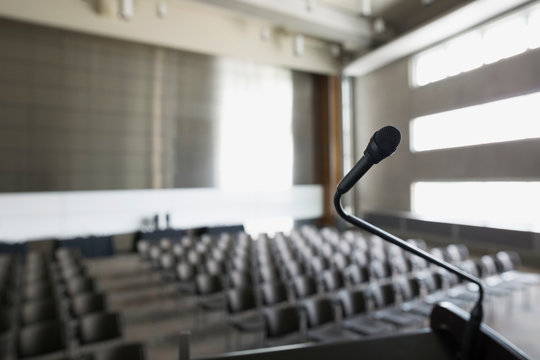 Microphone on podium in empty auditorium