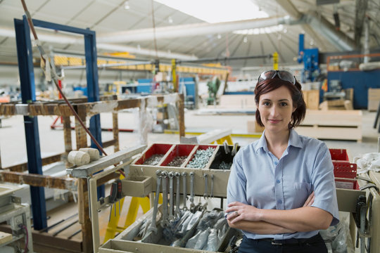 Portrait of confident worker in manufacturing plant