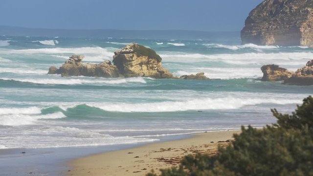 Wild coast Wild ocean waves breaking on a rock wall along the Australian coastline