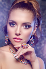 Brilliant. Girl with luxury jewelry. Model with a precious stone. Woman with a diamond.