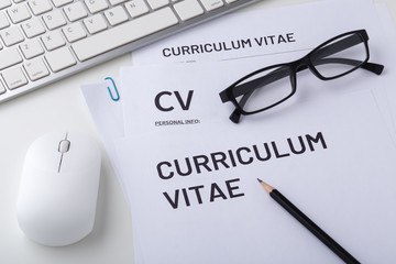 CV, curriculum vitae with computer keyboard and mouse