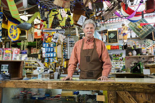 Portrait Confident Hardware Store Owner Behind Counter