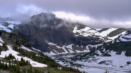 late afternoon shot of hidden lake and storm clouds at glacier national park