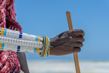 Tribal masai hand with a colorfull bracelet, closeup. Zanzibar, Tanzania, Africa