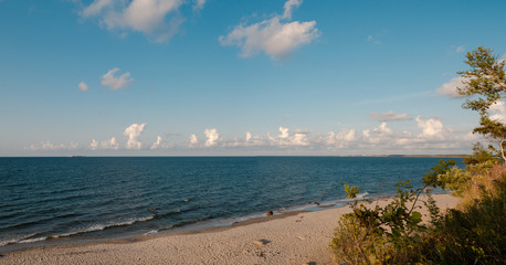 Seascape, calm sea, Zelenogradsk city in the background. Cloudscape, Baltic sea