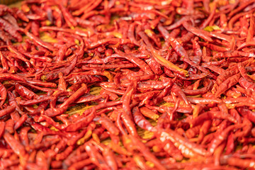 Red dried chili on bamboo basket background.Selective focus.