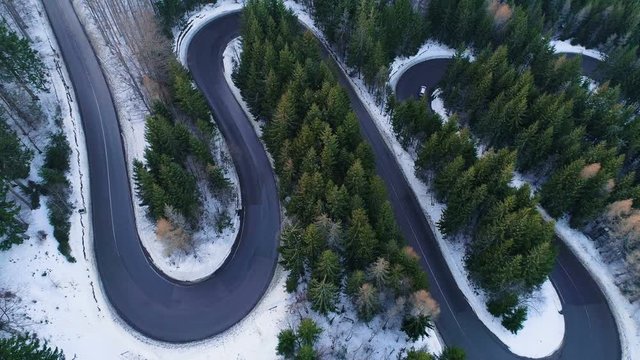 Aerial view of Wavy Road In The Mountains. Aerial At Winter