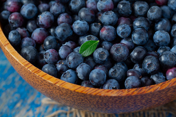 fresh blueberries in a wooden bowl