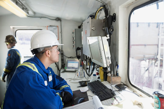 Male Engineer In Control Room At Gas Plant