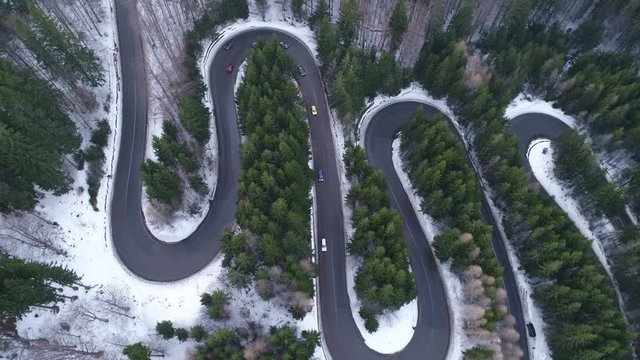Aerial view of Wavy Road In The Mountains. Aerial At Winter