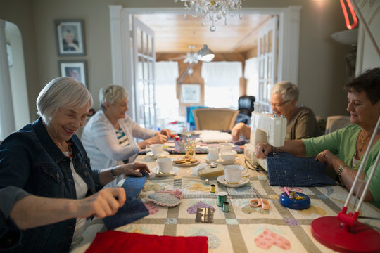 Senior Women Quilting At Table