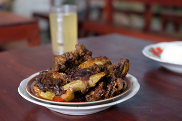 Tengkleng Kambing Pak manto, Solo, Central Java, Indonesia. Traditional Indonesian spicy food made from the bones of goat.