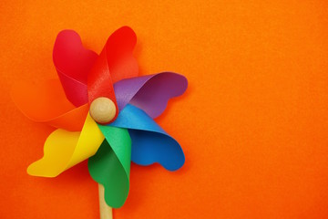 colorful pinwheel with space copy isolated on orange background