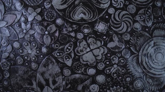 Abstract black grunge floral background. Plastic, acrylic paint flowers on canvas art. Luxury rotating motion texture. 4k.