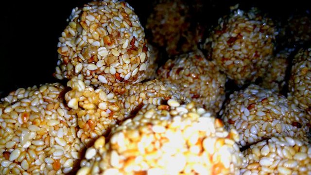 Closeup HD video of amarnath seed or sesame seed sweet, also known as til ka laddo, Indian sweet and healthy food.
