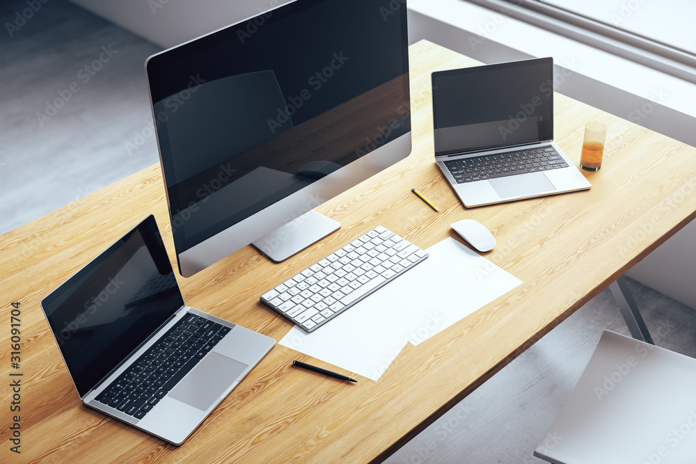 Aufkleber top view of desktop with several computers and work accessories. 3d rendering