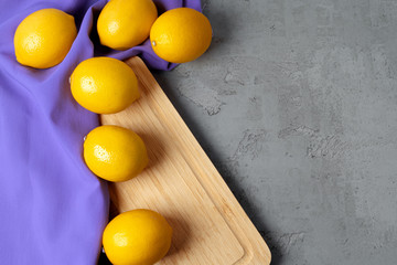Lemons on concrete background, view from above