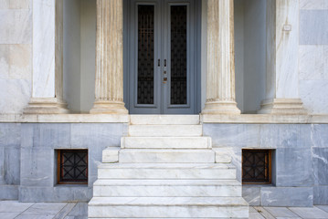 Fototapeta na wymiar Impressive entrance with marble columns, classical architecture building detail.