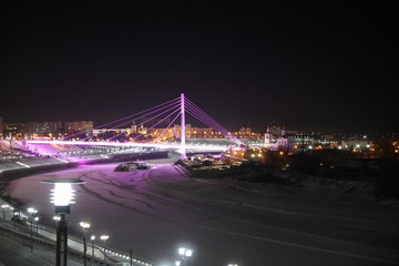 bridge over siberian river at night in wintertime