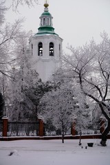 Fototapeta na wymiar winter scene with frozen trees and old church