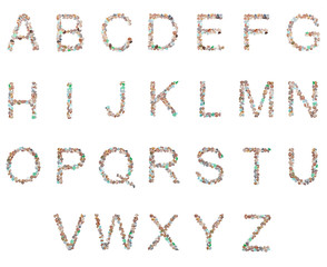 Naklejka premium The letters of the English alphabet from sea pebbles on an isolated background.