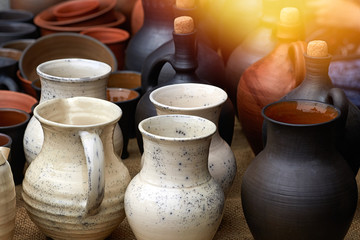 Closeup of many clay jugs