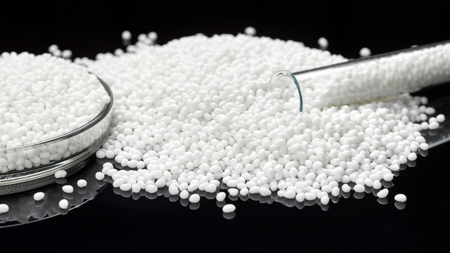 Closeup Of A Granule Of White Plastic Polymer