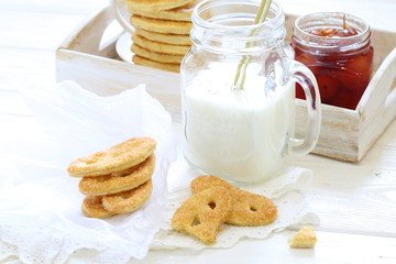 cookies and milk on wooden table