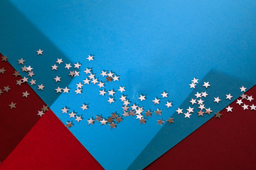 Glitter start on blue and red background 