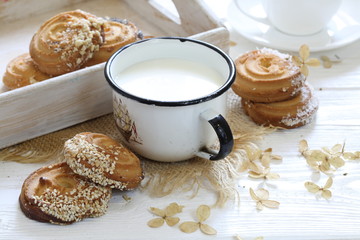 Cookies with milk on a wooden table