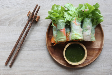Healthy eating concept, Top view of Vegetable salad with chopsticks on wooden background