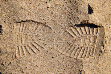 Footprint on the yellow sand for background or texture