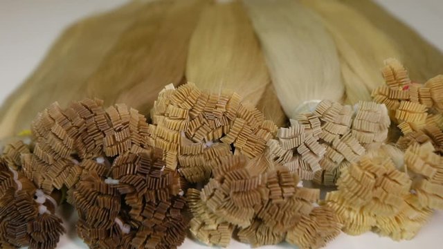 Long beautiful female hair, artificial long female hair in light shades