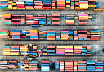 Container terminal in Port of Spain, aerial shot from above, many containers with different colors.