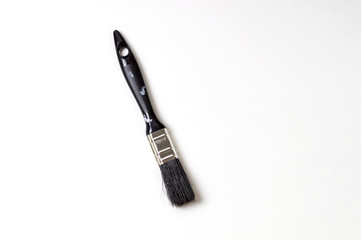 black paint brush on a white background