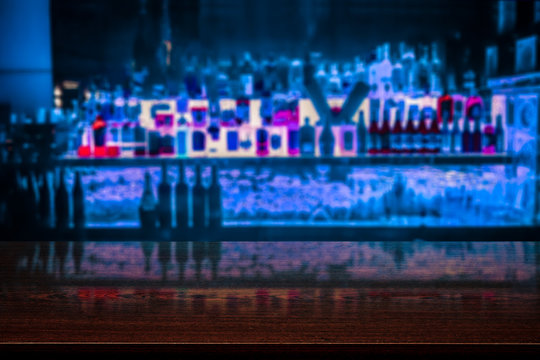 desk of free space and blurred bar background 