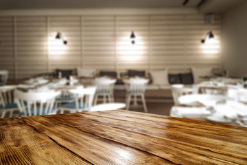 desk of free space and blurred bar background 