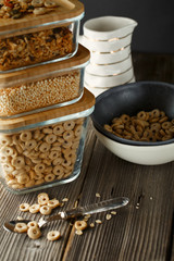 Breakfast cereal. Glass boxes with granola, cereal rings and Quinoa pops. Cereal Loops in a Bowl. Healthy Ready-to-eat breakfast for children. Quick breakfast cereals
