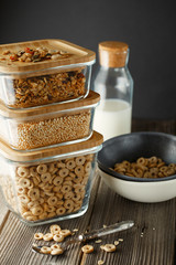 Breakfast cereal. Glass boxes with granola, cereal rings and Quinoa pops. Cereal Loops in a Bowl. Healthy Ready-to-eat breakfast for children. Quick breakfast cereals