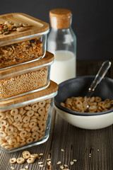 Breakfast cereal. Glass boxes with granola, cereal rings and Quinoa pops. Cereal Loops in a Bowl. Healthy Ready-to-eat breakfast for children. Quick breakfast cereals