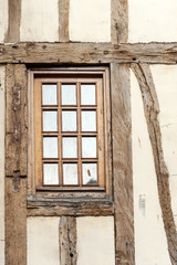 Typical antique window of old timerframe historic house in Rouen, France