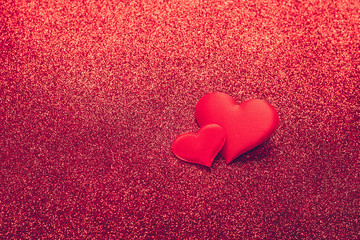 Two red heart symbol of love on a shiny background. Valentines day concept. Horizontal frame copy space.