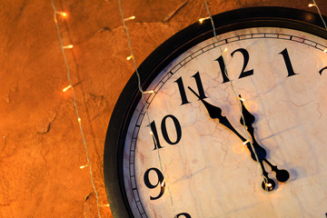 Fototapeta na wymiar Countdown to midnight. Retro style clock counting last moments before Christmas or New Year - Image