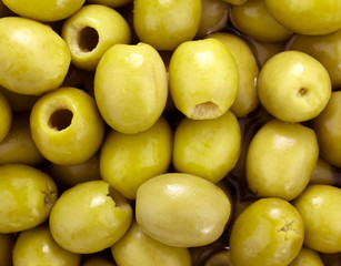 Many green olives as background