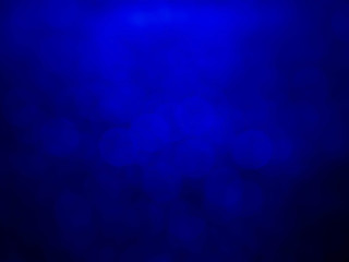 Blue bokeh background.Blue bokeh light in black background.