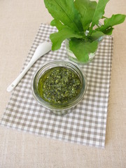 Green herbs pesto with dandelion leaves