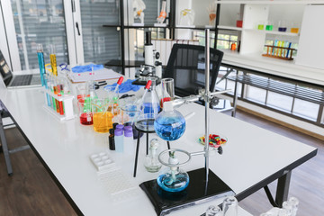 Tool and equipment on table of chemist in laboratory room