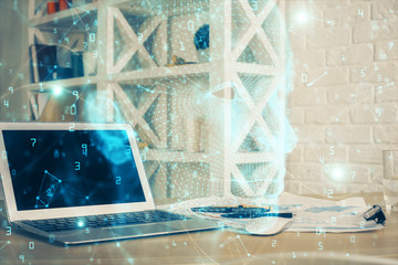 Multi exposure of work table with computer and brain hologram. Brainstorm concept.