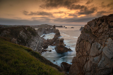 Cliffs and rocks formations of the Costa Quebrada at sunset. Cantabria, Spain.
